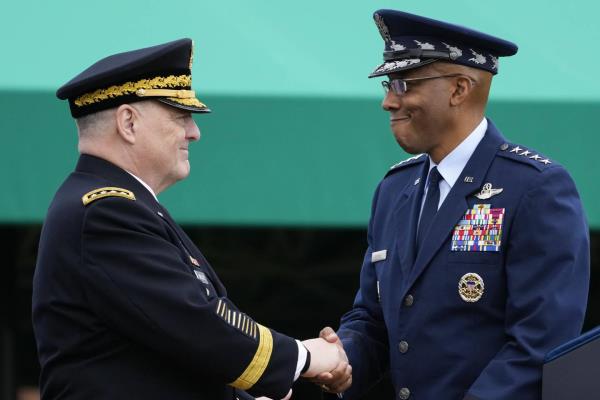 Retiring Chairman of the Joint Chiefs of Staff Gen. Mark Milley, left, shakes hands with Gen. CQ Brown, Jr., the incoming chairman, right, during the Armed Forces Farewell Tribute in ho<em></em>nor of Milley at Joint ba<em></em>se Myer-Henderson Hall, Friday, Sept. 29, 2023, in Fort Meyer, Va.